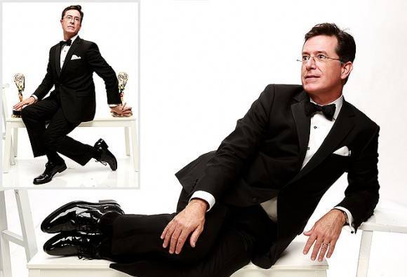 Stephen Colbert posing with his Emmy awards