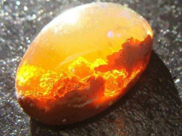 It's like someone put a sunset in this gem... Beautiful Fire Opal.