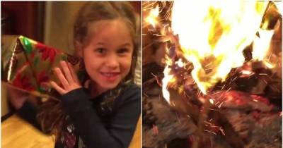 Dad Trolls His Young Daughter By Throwing Fake Presents On The Fire
