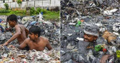 Bangladesh Street Cleaners Wear Only Plastic Bags As Part Of PPE While Swimming Up To Their Necks In Heaps Of Rubbish