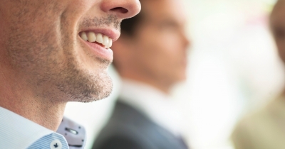 The Real Meaning Behind The 'Hung Smile' — And Why People Think It Reveals A Man's Size